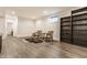 Finished basement space with vinyl floors, built in shelving, and a cozy seating area at 1955 Alvord St, Indianapolis, IN 46202