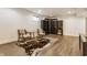 Finished basement space with vinyl floors, built in shelving, and a cozy seating area at 1955 Alvord St, Indianapolis, IN 46202