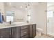 Modern bathroom featuring double vanity, sleek mirrors and tiled shower at 1955 Alvord St, Indianapolis, IN 46202