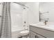 Bathroom featuring a shower-tub combo, patterned shower curtain, and grey vanity at 1955 Alvord St, Indianapolis, IN 46202