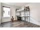 Bedroom with a metal loft bed, desk, and a window that brings in natural light at 1955 Alvord St, Indianapolis, IN 46202