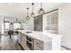 Open concept kitchen featuring a large island, stainless appliances, and access to the living area at 1955 Alvord St, Indianapolis, IN 46202