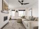 Bright and airy living room featuring a fireplace, large windows, and comfortable seating arrangement at 1955 Alvord St, Indianapolis, IN 46202