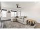 Cozy living room with a comfortable sectional, accent drum table, large windows, and modern decor at 1955 Alvord St, Indianapolis, IN 46202