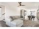 Bright living room featuring a comfortable sectional sofa, modern ceiling fan, and an open layout to the dining area at 1955 Alvord St, Indianapolis, IN 46202