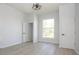 Bright bedroom features modern flooring, neutral walls, and a large window at 249 N Hamilton Ave, Indianapolis, IN 46201