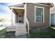 Inviting front porch with fresh wooden stairs, providing a cozy entrance to the home at 249 N Hamilton Ave, Indianapolis, IN 46201