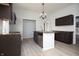 Spacious kitchen with dark cabinets, butcher block countertops, stainless steel appliances and an open design at 249 N Hamilton Ave, Indianapolis, IN 46201