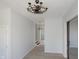 Spacious living area with a view of the stairs and a modern light fixture at 249 N Hamilton Ave, Indianapolis, IN 46201
