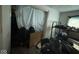 A cluttered bedroom contains furniture and personal items in need of organization and care at 2820 N Gladstone Ave, Indianapolis, IN 46218