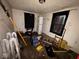 This bedroom has hardwood floors, dark curtains, and some miscellaneous items throughout at 2820 N Gladstone Ave, Indianapolis, IN 46218