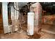 Unfinished basement with modern furnace and hot water heater at 32 E Main St, Mooresville, IN 46158