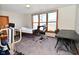 Bright bedroom with hospital bed, ample sunlight, and adaptive medical equipment at 32 E Main St, Mooresville, IN 46158