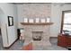 Attractive brick fireplace with a mantel shelf offering a cozy focal point for this room at 32 E Main St, Mooresville, IN 46158