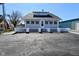 Inviting home with an eye-catching white fence, complemented by a spacious driveway for easy parking at 32 E Main St, Mooresville, IN 46158