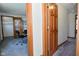 Neutral hallway with carpet and wood trim, leading to a potential office or bedroom at 32 E Main St, Mooresville, IN 46158