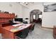 Spacious office featuring a work area, cabinets, and archway entrance to other rooms at 32 E Main St, Mooresville, IN 46158