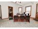 Office space featuring a large desk, natural light, and hardwood trim throughout at 32 E Main St, Mooresville, IN 46158