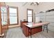 Bright office area showcasing large windows and storage cabinets in neutral tones at 32 E Main St, Mooresville, IN 46158