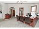 Spacious office area with a large desk, neutral walls, and a ceiling fan at 32 E Main St, Mooresville, IN 46158