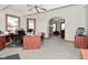 Large office space featuring dual windows, a fireplace, and lots of room for furniture at 32 E Main St, Mooresville, IN 46158