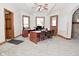 Bright office space with hardwood trim, multiple windows, and room for desks and seating at 32 E Main St, Mooresville, IN 46158