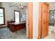 Well-lit office with large windows and ample storage space, plus an adjacent bathroom at 32 E Main St, Mooresville, IN 46158