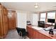 Comfortable office space with large desk, storage cabinets, and natural lighting at 32 E Main St, Mooresville, IN 46158