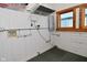 Functional utility room with white-paneled walls and convenient storage solutions at 32 E Main St, Mooresville, IN 46158
