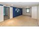Finished basement with carpeting, large wall graphic, and ample natural light at 3548 W 500 North Rd, McCordsville, IN 46055