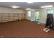 Spacious finished basement featuring built-in shelves, lighting, and an exterior door at 3548 W 500 North Rd, McCordsville, IN 46055