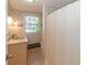 Bathroom features a tiled floor, a shower with curtain, a sink with vanity, and a window at 3548 W 500 North Rd, McCordsville, IN 46055