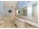 Bathroom featuring dual sinks, white cabinets, and floral wallpaper at 3548 W 500 North Rd, McCordsville, IN 46055