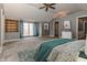 Spacious bedroom with carpet, french doors, a ceiling fan, and neutral gray walls at 3548 W 500 North Rd, McCordsville, IN 46055