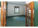 Bedroom with green carpet and double doors leading to another room at 3548 W 500 North Rd, McCordsville, IN 46055