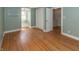 Bright bedroom featuring hardwood floors, a window seat, and ample closet space at 3548 W 500 North Rd, McCordsville, IN 46055