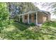 Charming home with a covered front porch and well-maintained lawn and garden at 3548 W 500 North Rd, McCordsville, IN 46055