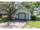 Exterior of a detached garage with a white door and lush green lawn at 3548 W 500 North Rd, McCordsville, IN 46055