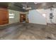 Unfinished garage interior with work bench, concrete floor, and overhead lighting at 3548 W 500 North Rd, McCordsville, IN 46055