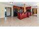 Open kitchen with granite counters, red cabinets, stainless steel appliances, and large island with seating at 3548 W 500 North Rd, McCordsville, IN 46055