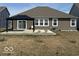 A backyard with a small patio, a gazebo, and a grassy area, ready for outdoor enjoyment at 3581 Free Spirit Ct, Westfield, IN 46074