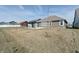 Large backyard showcasing a cozy pergola and ample lawn, providing a perfect setting for outdoor activities at 3581 Free Spirit Ct, Westfield, IN 46074