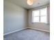 Bright, carpeted bedroom with large window and neutral walls creates a serene and comfortable space at 3581 Free Spirit Ct, Westfield, IN 46074
