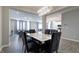 Open-concept dining room with modern chandelier and seamless connection to living area at 3581 Free Spirit Ct, Westfield, IN 46074