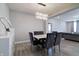 Inviting dining area with elegant table and chairs, complemented by stylish lighting at 3581 Free Spirit Ct, Westfield, IN 46074