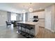 Spacious kitchen with white cabinets, stainless appliances, and island with bar seating at 3581 Free Spirit Ct, Westfield, IN 46074