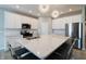 Well-lit kitchen with white cabinets, quartz countertops, and stainless steel appliances at 3581 Free Spirit Ct, Westfield, IN 46074