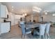 Bright, open kitchen and dining area with stainless steel appliances and modern lighting at 3581 Free Spirit Ct, Westfield, IN 46074