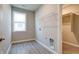 Laundry room with window, shelving, and utility connections offers functionality and natural light at 3581 Free Spirit Ct, Westfield, IN 46074