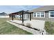 Outdoor patio with a modern pergola offering shade and style, with landscaped beds around the patio at 3581 Free Spirit Ct, Westfield, IN 46074